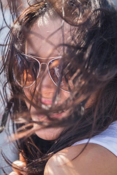 Brunette woman on a yacht sailing