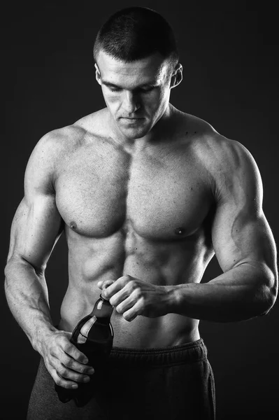 Muscular guy with a beer