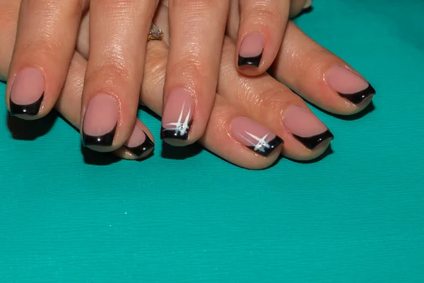 Female hands with painted nails.