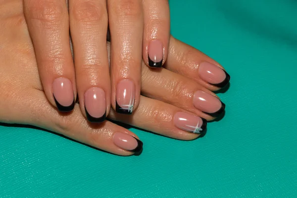 Female hands with painted nails.