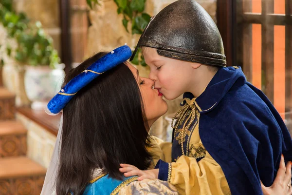 Mother and son in medieval costumes