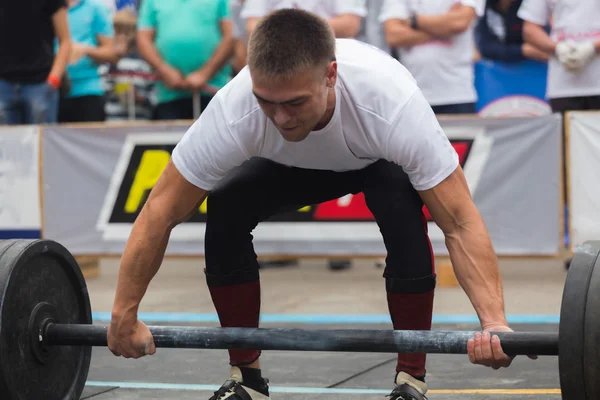 Professional athletes performing strength exercises