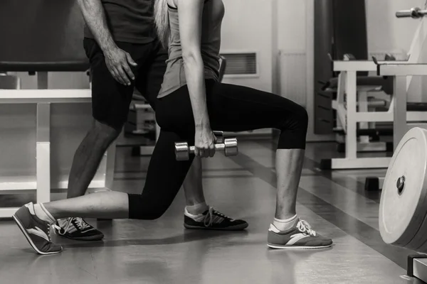Young couple in the gym at the joint training