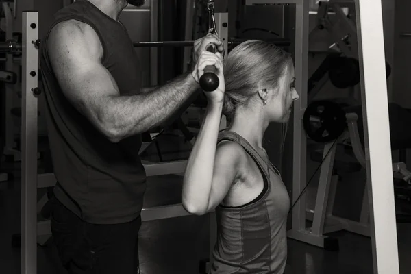 Young couple in the gym at the joint training.