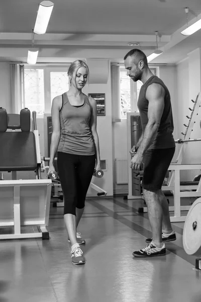 Sport couple on training in the gym.
