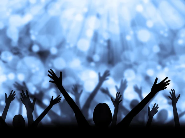 Silhouette of people raising hands on abstract background