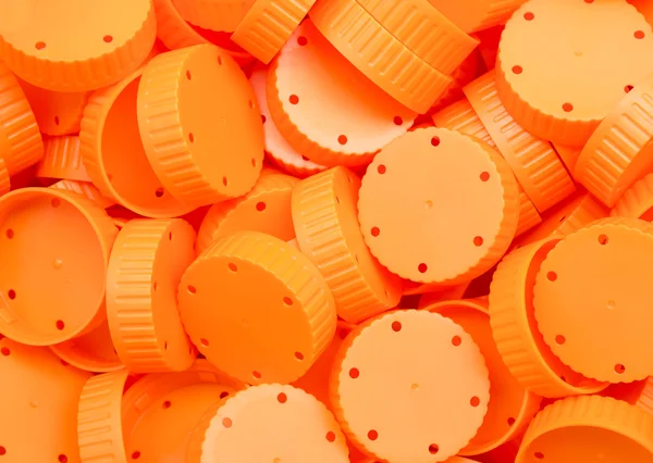 Orange lid of plastic bottles talcum powder