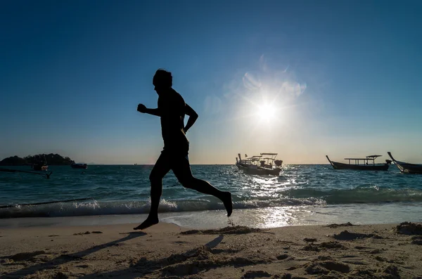 Silhouette of runner at sunrise