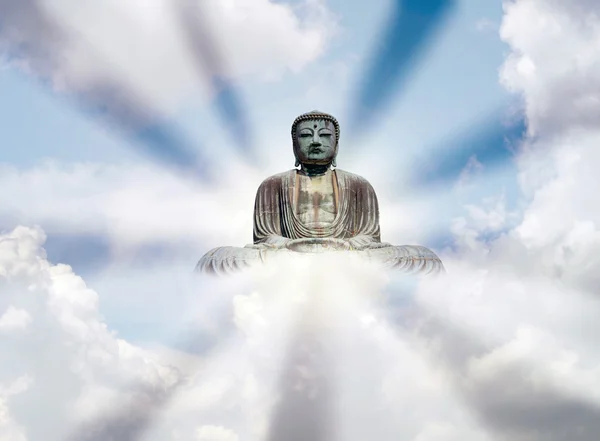 The Big Buddha (Daibutsu) over the cloud and sky with sun ray