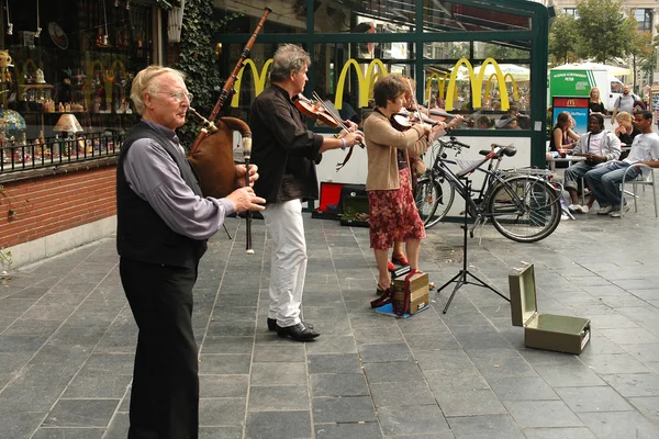 Street musicians playing on a street in Antwerp