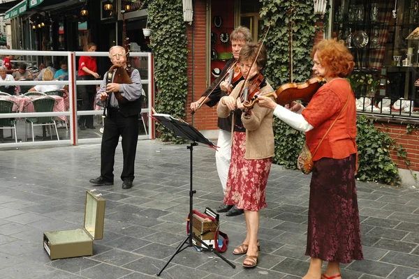 Street musicians playing on a street in Antwerp