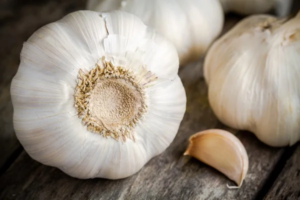 Organic garlics with clove close up on a dark background