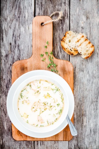Homemade soup with salmon and cream