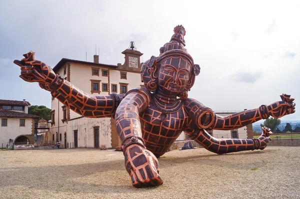 The sculpture entitled Three Heads Six Arms by Chinese artist Zhang Huan located in Forte di Belvedere Florence Italy