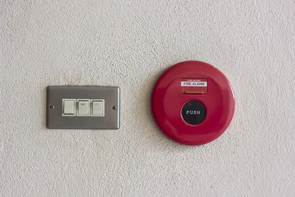 Fire alarm control panel on wall