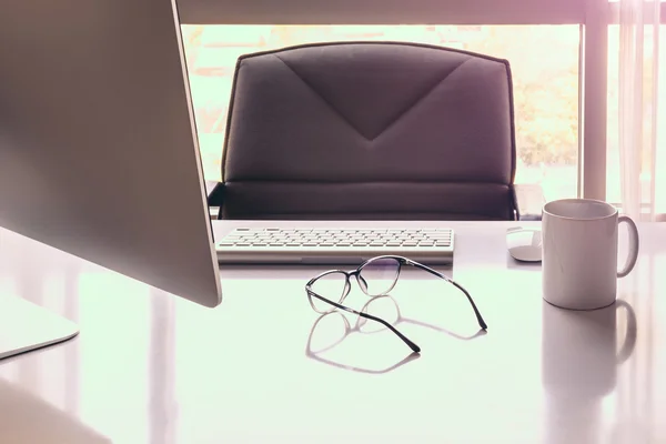 Manager Table with Desktop Computer and eye glasses