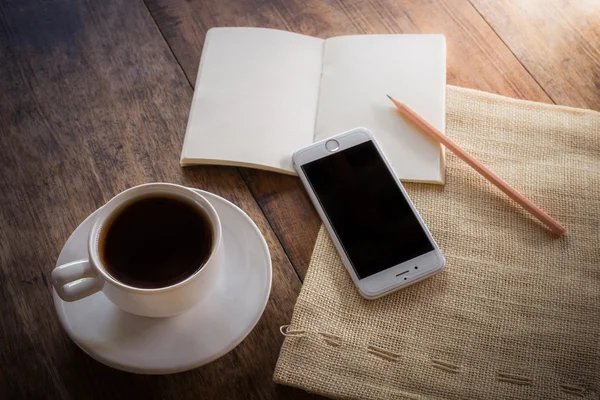 Cup of coffee on a wooden table