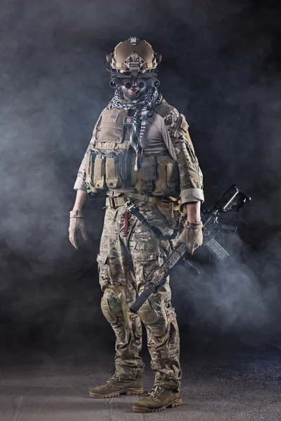 US Army Soldier with goggles in the Smoke