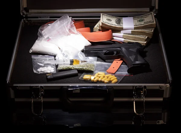 Case with money, gun and drugs