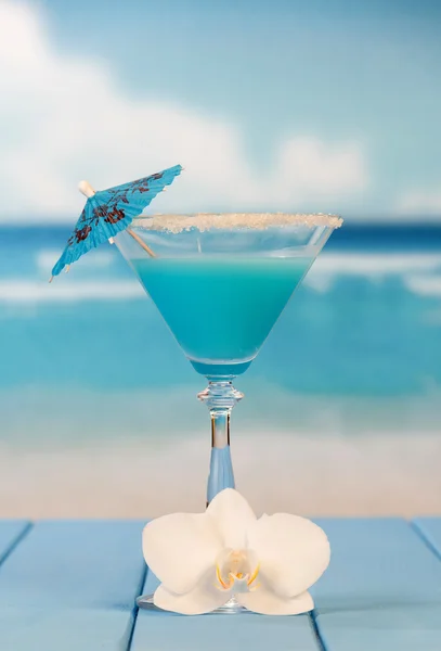Cocktail with umbrella and flower
