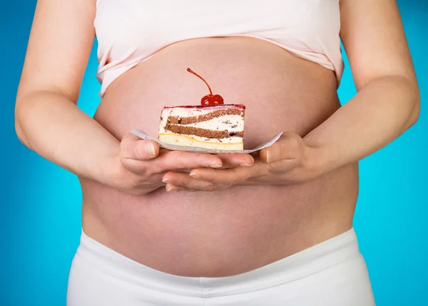 Pregnant woman with cake