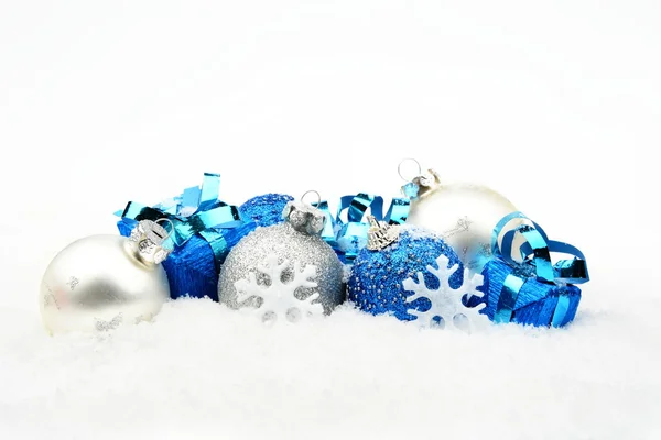 Blue,silver christmas decoration on snow