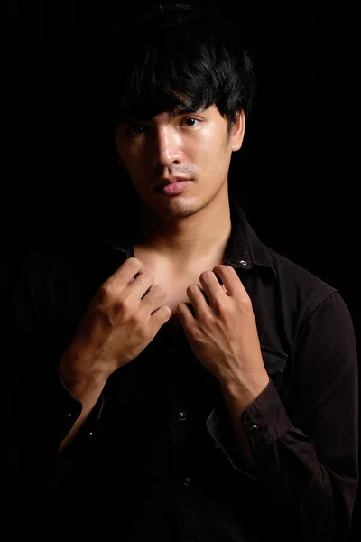 Asian man portrait in the dark