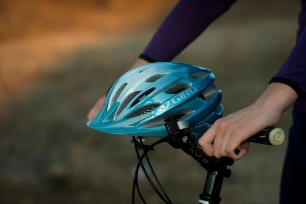 Young bicyclist in helmet