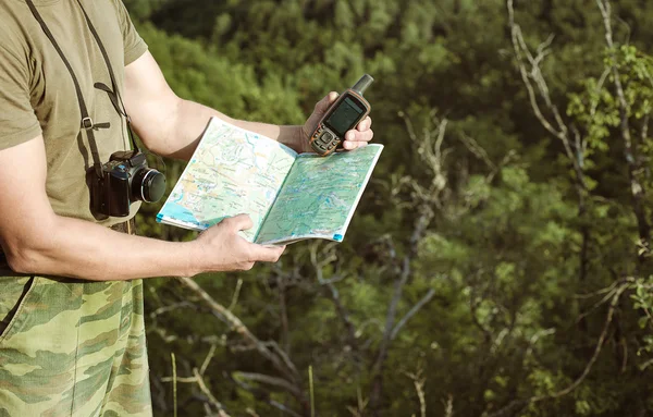 Young man hiking smiling happy portrait. Male hiker walking in f