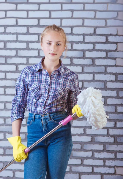 Girl washes the floors