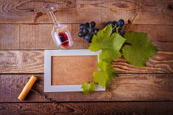 Frame design with grapes and a bottle of red wine. background and texture
