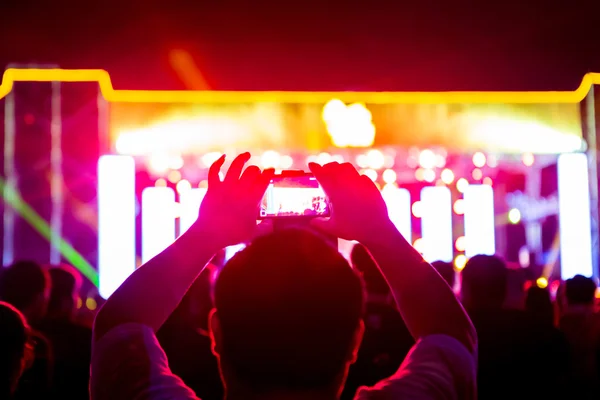 Take photo in front of concert stage