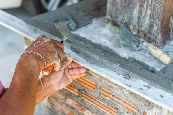 Man works on wall construction