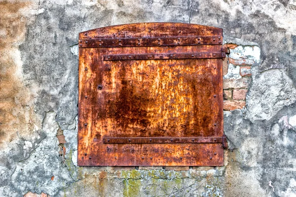 Rusty window in old Italian farmhouse