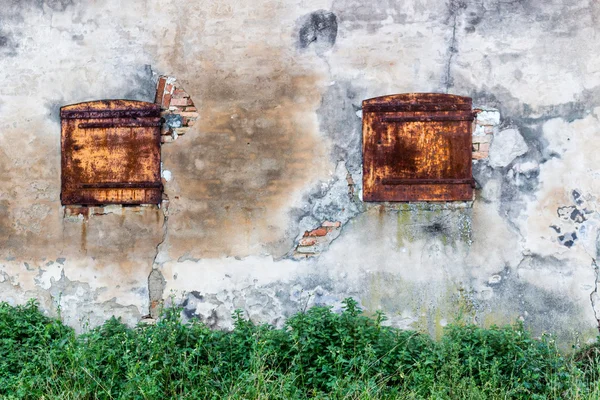 Rusty windows in old Italian farmhouse