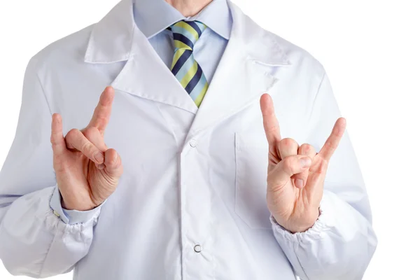Man in medical coat making sign of the horns