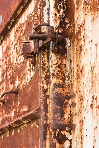 Lock on rusty iron door