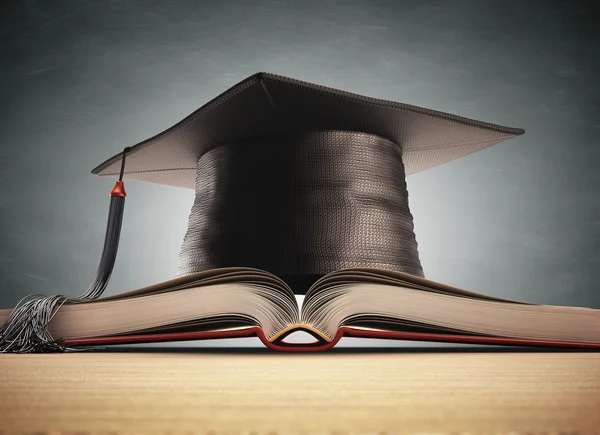 Graduation cap over the book