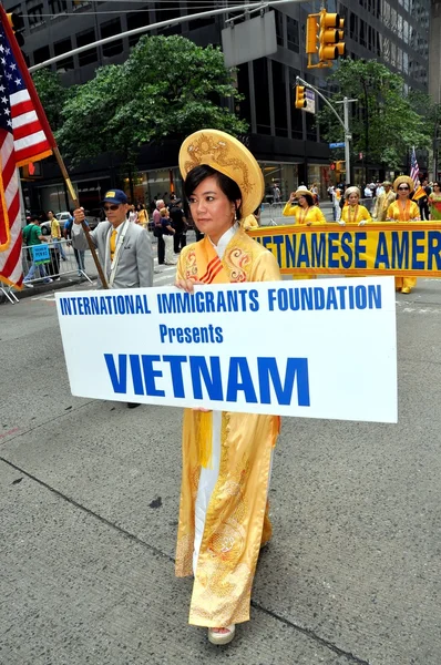 NYC: Vietnamese Woman with Sign at Immigrants Parade