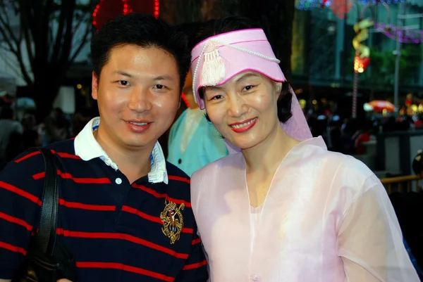Singapore: Asian Man and Woman on Orchard Road
