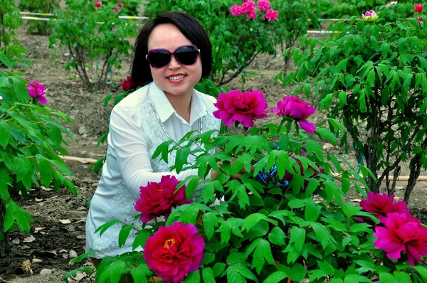 Pengzhou, China: Woman with Peony Flowers