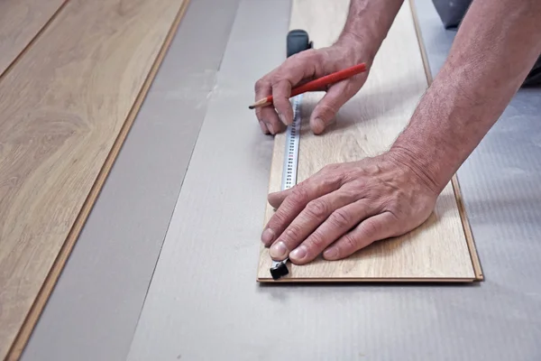 Hands of the carpenter line is measured