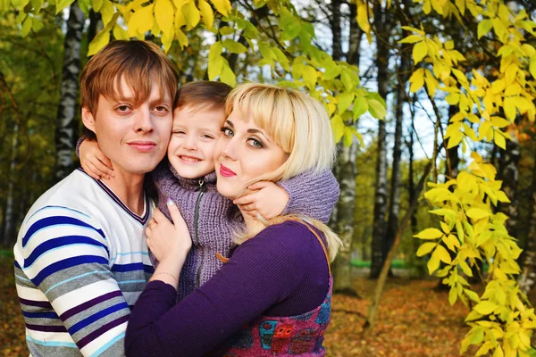 Happy family in autumn Park