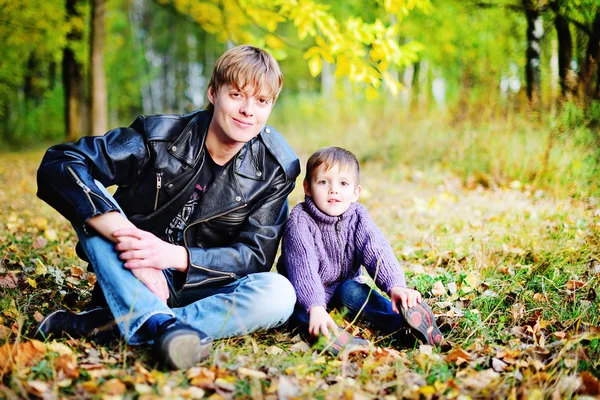 Dad and son in autumn Park