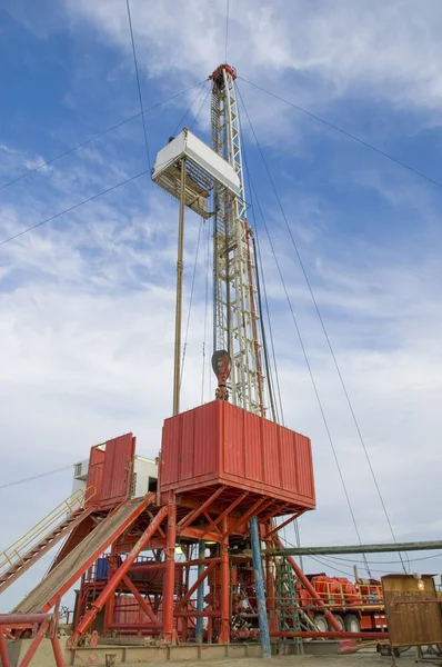 Loaded drilling rig on a desert under blue sky