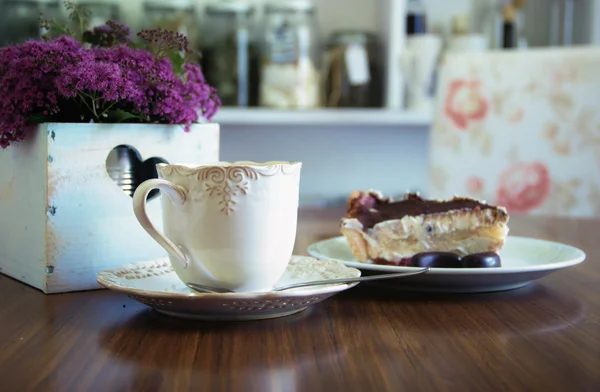 Coffee and Cake with Kitchen Background