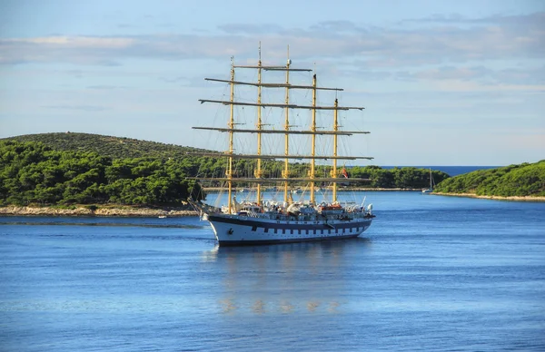 Clipper is Sailing Away from Island