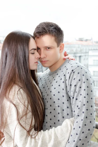 Couple in passion hugging nose to nose