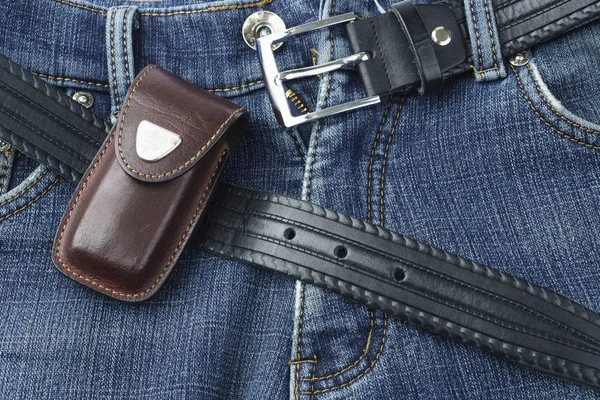 Blue jeans with leather belt and knife case