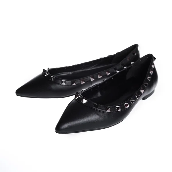 Pair of black patent leather female shoes isolated on white back